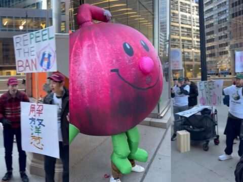 Students march with a giant onion balloon in Chicago.